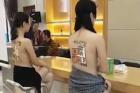南宁一楼盘开盘促销 户型图印在女模特裸背上